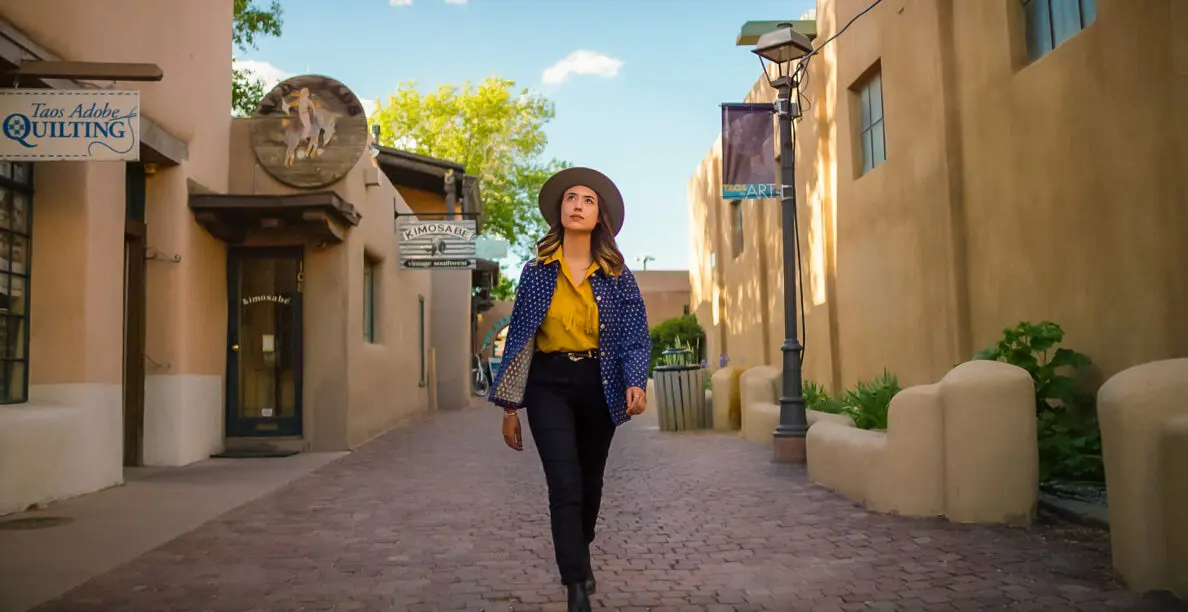 A women walking through downtown Taos