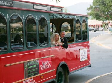 A married couple riding the Taos Trolley