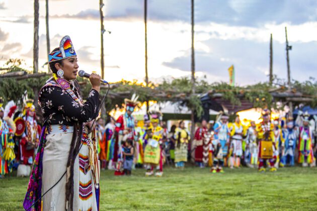 A woman singing at the Taos Pueblo Pow Wow
