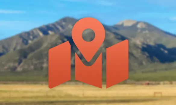 A guide icon in from of Taos Mountain