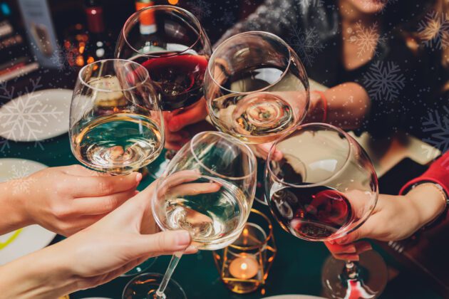 People toasting with wine glasses
