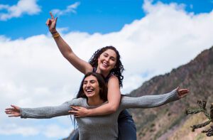Joyous young women in Taos Gorge