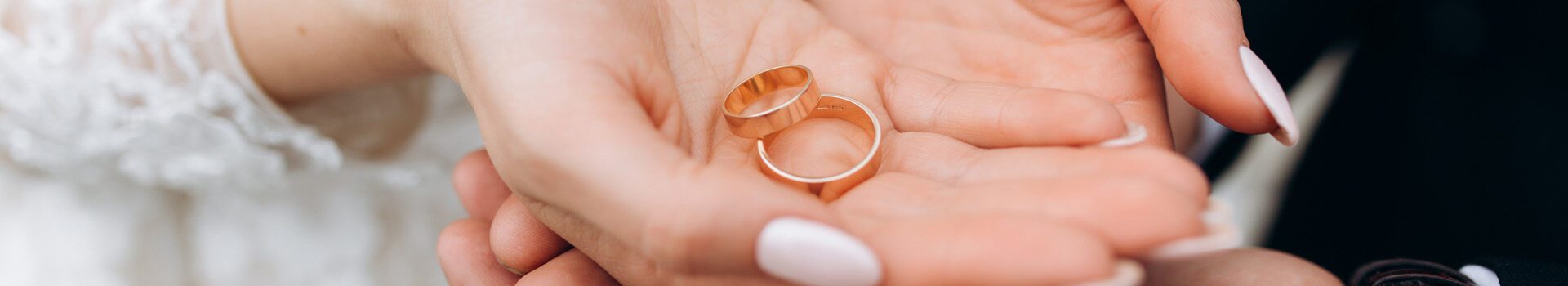 A couple's hands with wedding rings