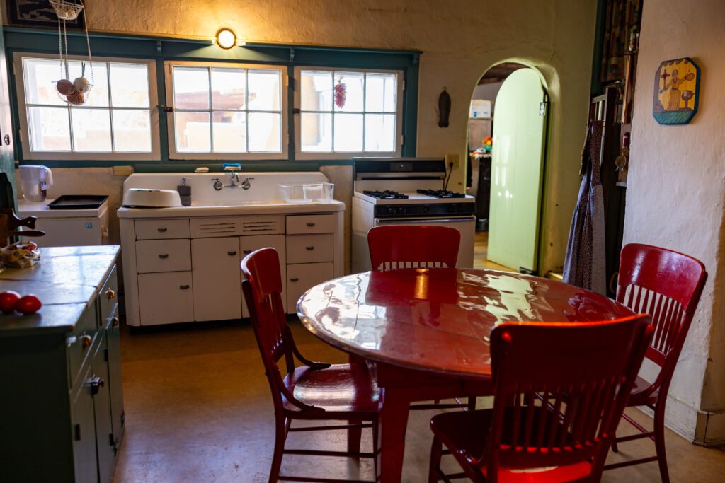 A kitchen with old appliances in the Couse home